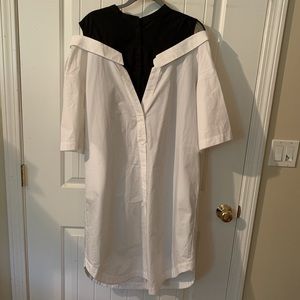 A shirt dress with cutout details and pockets.